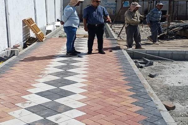 اجرای سنگفرش پیاده رو ها در بوستان در حال احداث دانشسرا